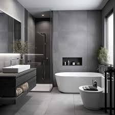 Renovated modern bathroom with a freestanding tub, large-format grey tile and a floating vanity