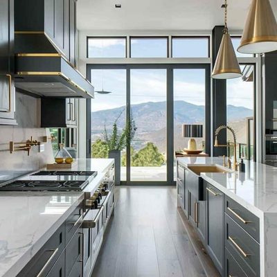 Renovated open-plan kitchen with a large island, pendant lighting and full-height windows