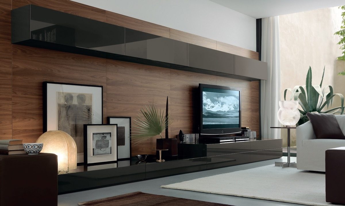 Horizontal wood slat media wall with a mounted TV and floating shelf