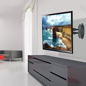 Flat-screen TV on a full-motion articulating wall arm above a floating drawer console