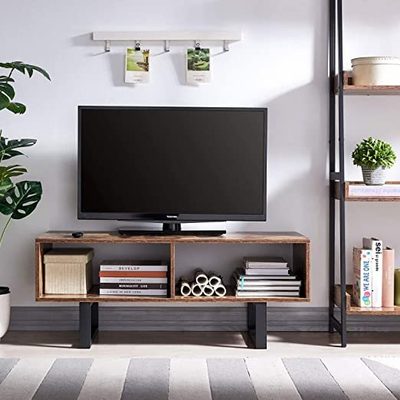 Wall-mounted TV above a media console with floating shelves